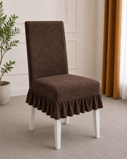 Set of brown jacquard frill chair covers on dining chairs